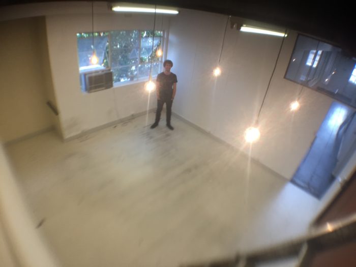 james standing in new office